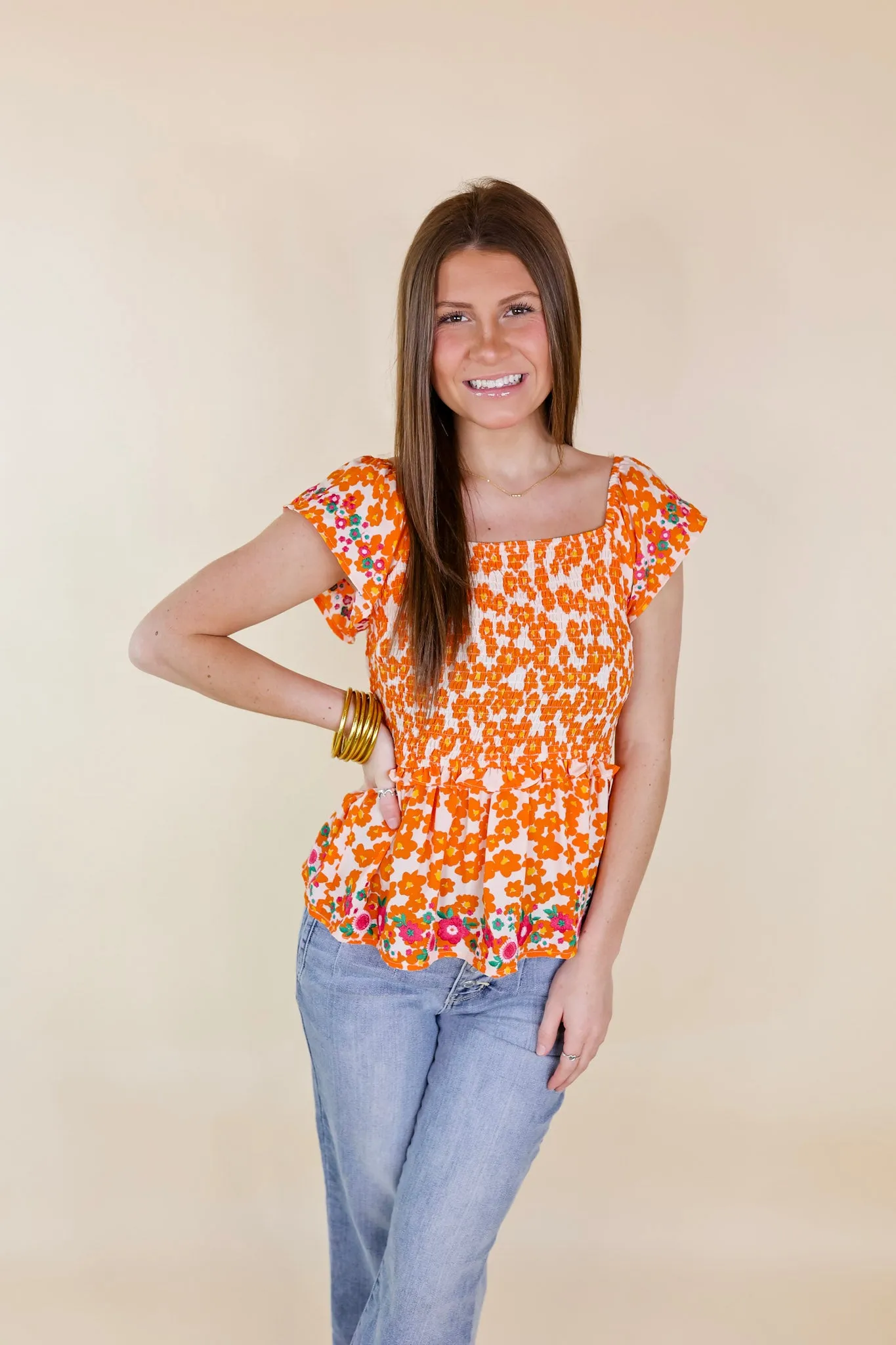 Blossom Boulevard Smocked Floral Peplum Top with Floral Embroidery in Orange